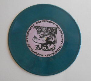 Teal opaque vinyl 7 inch record
